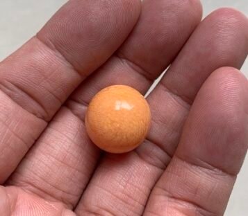 Exquisite 29.65 Carat Deep Orange Round Melo Melo Pearl
