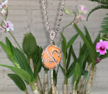 Very Rare Huge Natural Deep Orange Oval Melo Pearl Necklace Adorned with Diamonds