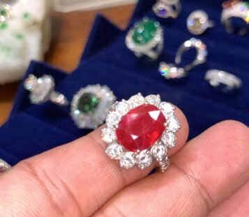 Oval Cut Faceted Ruby Ring With Diamonds